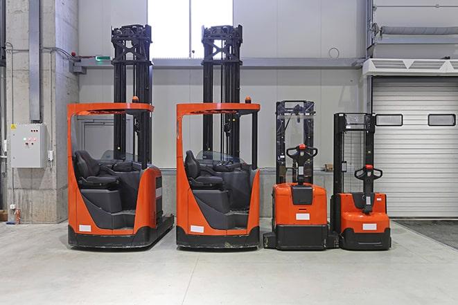 forklifts maneuvering through a factory